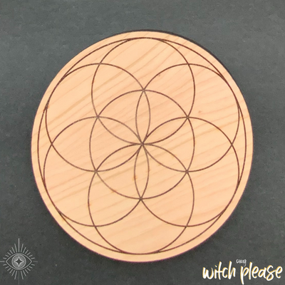 Seed of Life design laser engraved on a wood circle