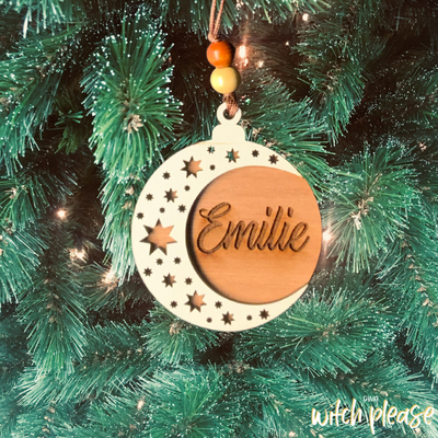 Custom Christmas ornament with a crescent moon and stars laser cut from wood